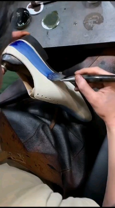 A leather piece being hand-restored at the De Leather Craft atelier